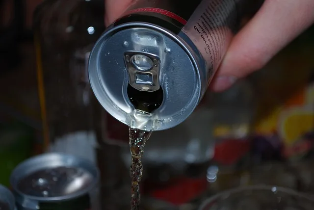 "A sleek, silver can of Uptime Energy Drink with a vibrant blue logo."